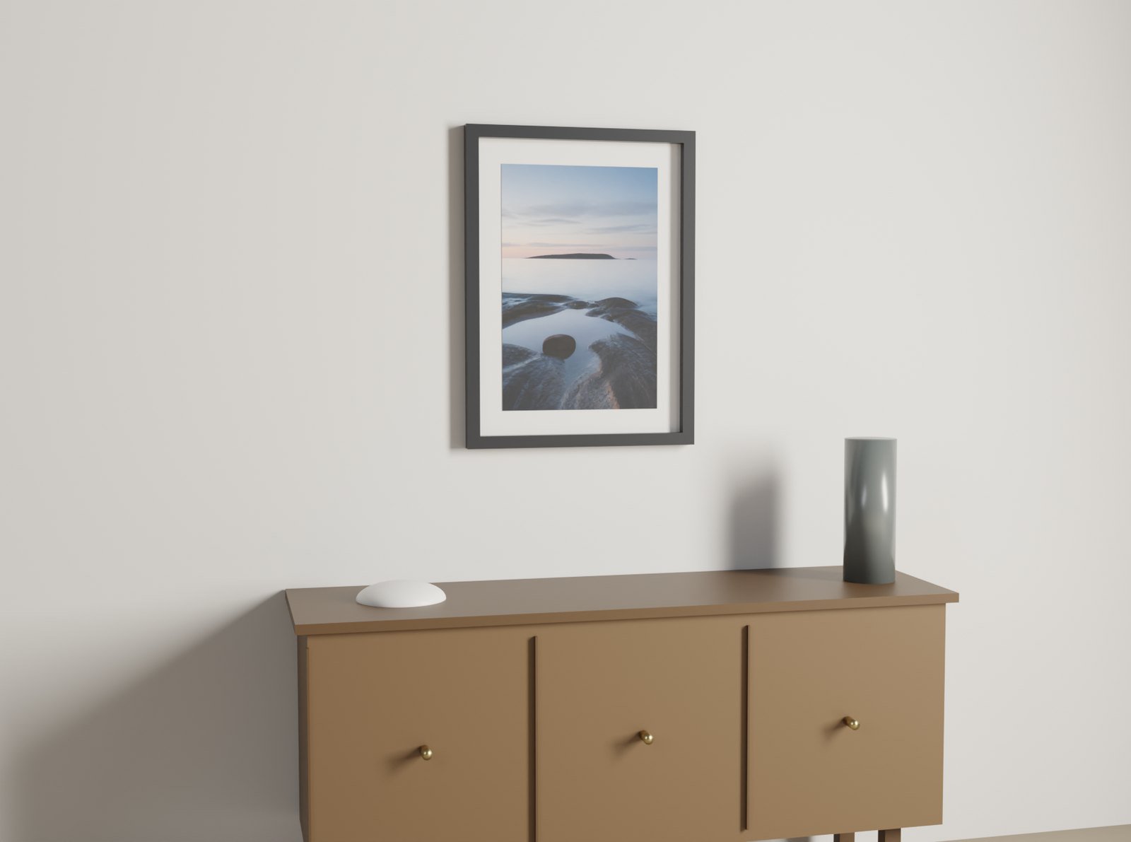 A 50 by 70 centimetre framed print hanging above a sideboard